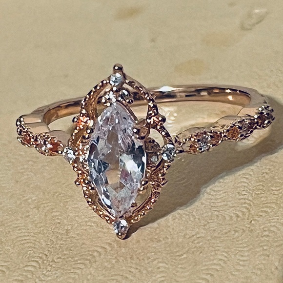 Jewelry - Gold Marquise Halo Engagement Ring with Clear Stone